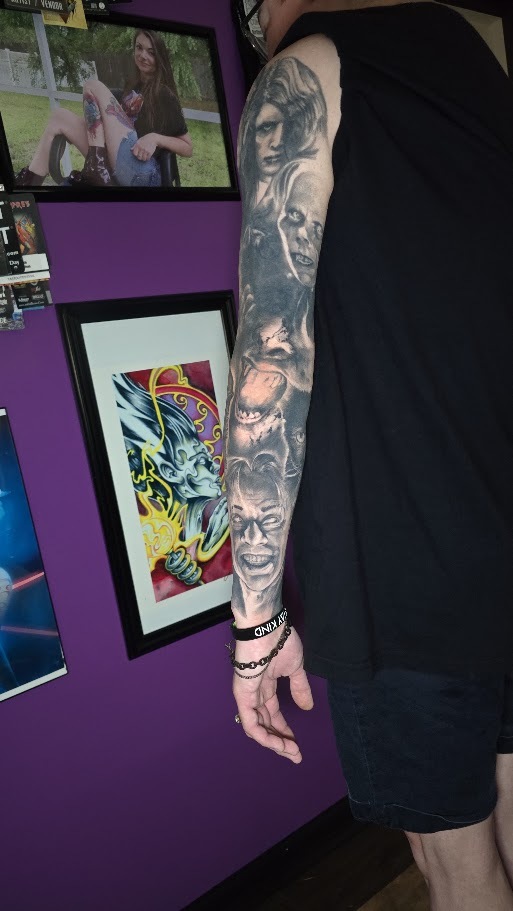 Back view of a black and grey classic horror sleeve by Billy