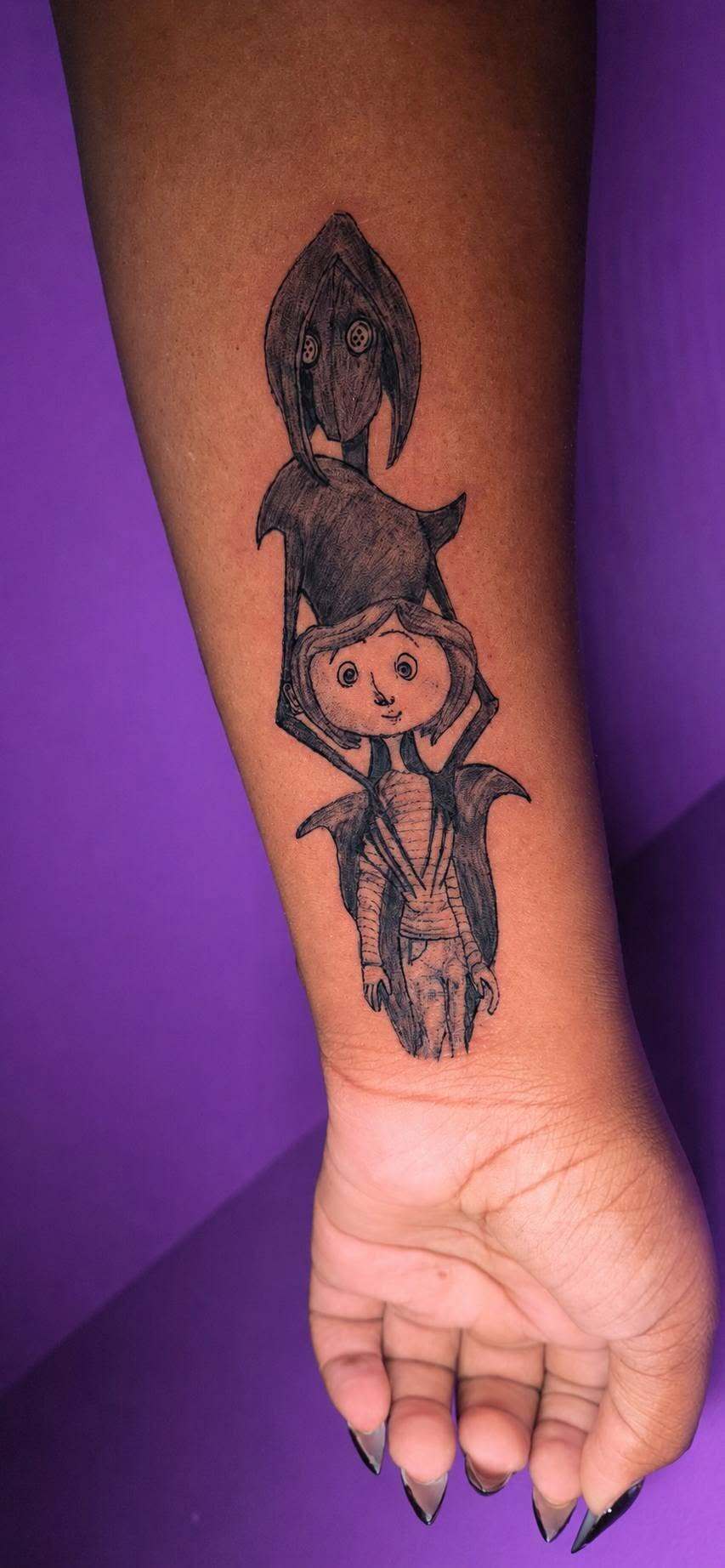 Black and grey Coraline character forearm tattoo by Cherae