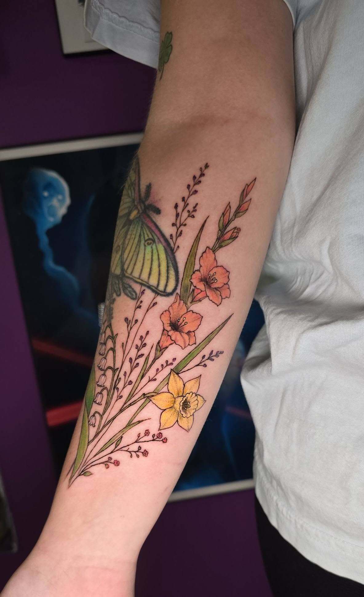 Full color moth and wildflower forearm tattoo by Cherae